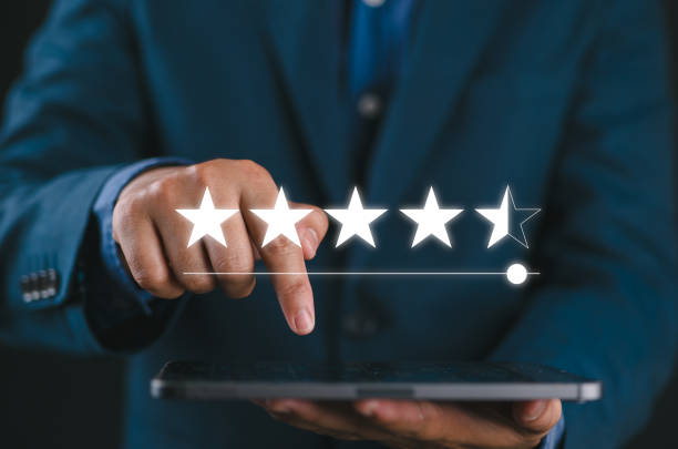 istock Businessman using mobile phone give five stars for excellent evaluate after customer use product service, ISO and quality control, standard certificate, standardization, satisfaction feedback review 2178213856