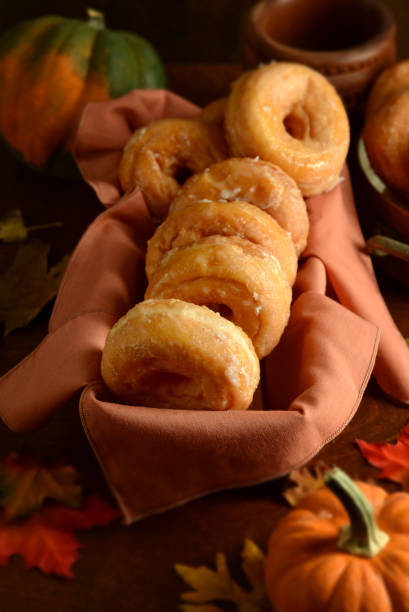 istock Glazed Autumn Honey Pumpkin Donuts 2178214068