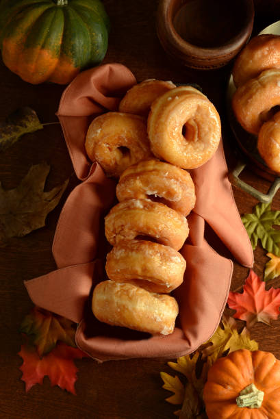 istock High Angle View of Glazed Autumn Honey Pumpkin Donuts 2178214113