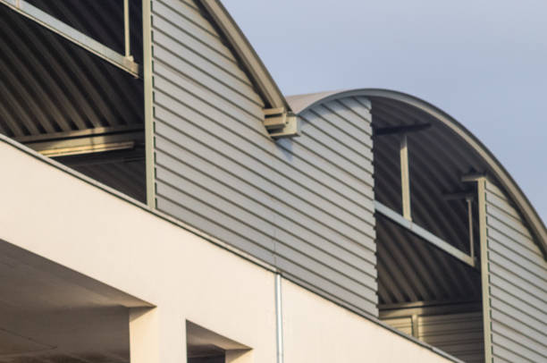 istock large industrial building with round metal roof 2178214578