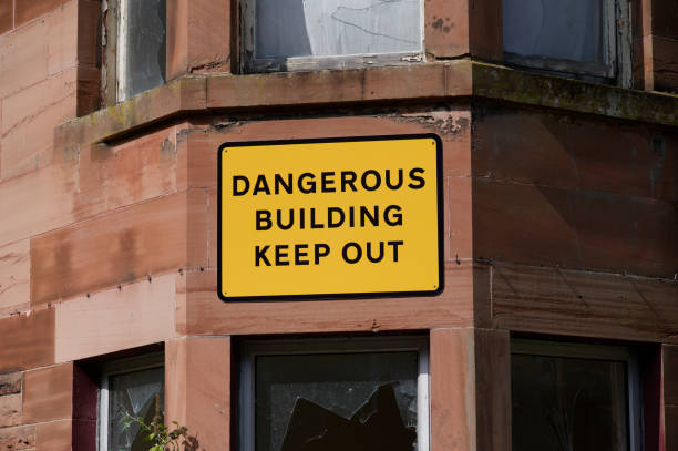 istock Dangerous building keep out sign on building ready to be demolished 2178215195