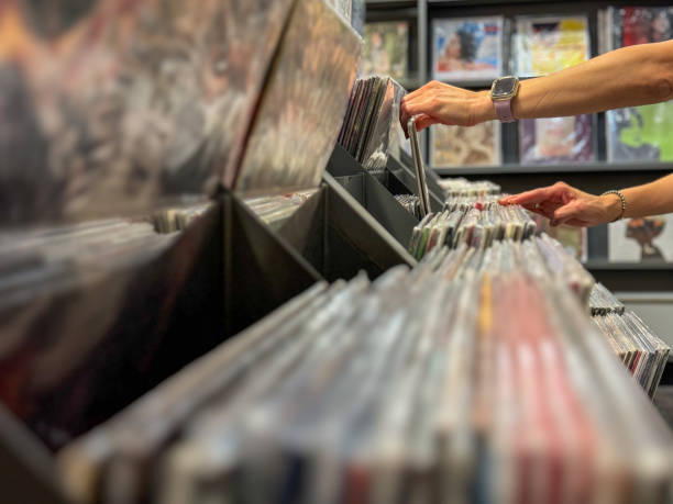 istock Female hand selecting vinyl records 2178223941