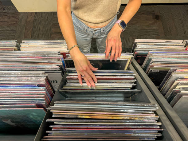 istock Female hand selecting vinyl records 2178223942