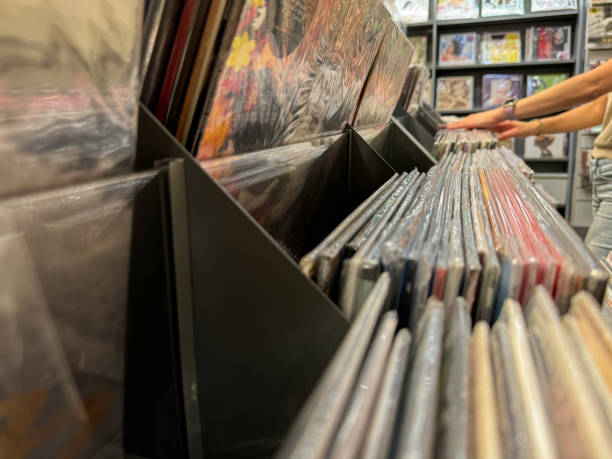 istock Female hand selecting vinyl records 2178223947