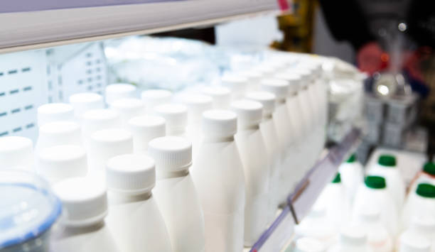 istock Milk bottles on the supermarket shelf 2178224693