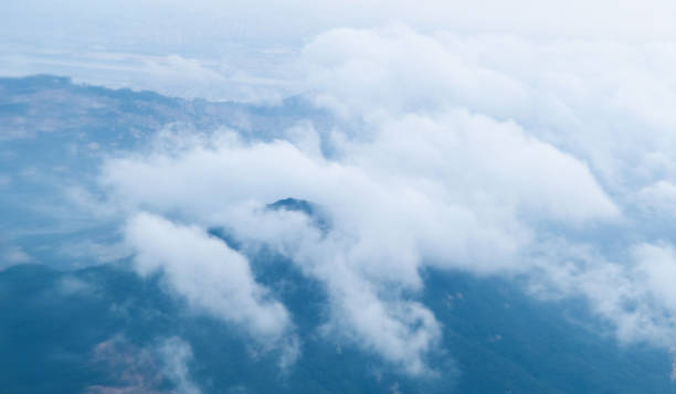 istock Airplane view of mountains with clouds 2178226169