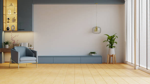 istock Modern minimalist interior with an armchair on empty dark blue wall background,Mockup for TV- 3D rendering 2178229057