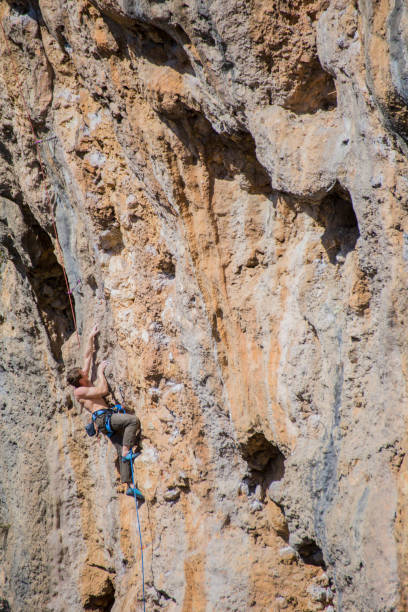 istock A rock climber ascends to the summit via a difficult route. 2178233899