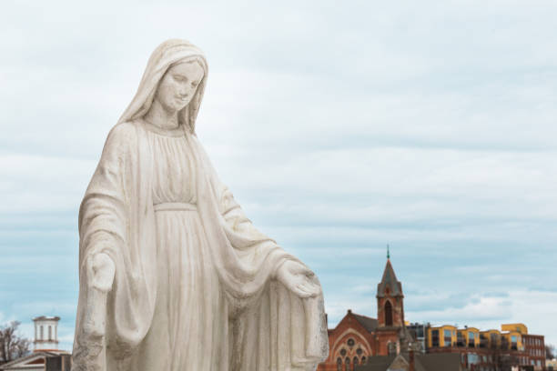 istock Mother Mary Immaculate Conception Statue Blessing Praying Over City 2178236088