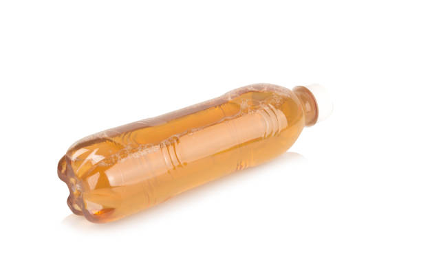 istock plastic bottle isolated on white background, water yellow 2178240250
