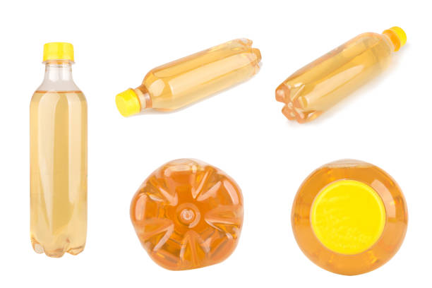 A neatly arranged row consisting of five transparent bottles, each filled with a dark liquid