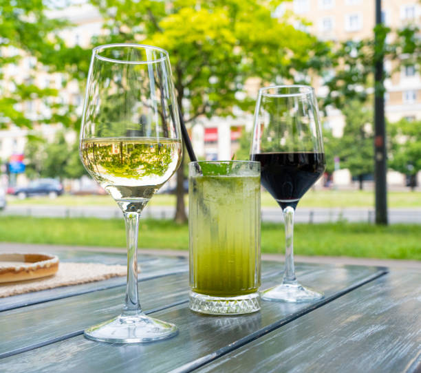 istock Red wine, herbal lemonade and white wine glasses on restaurant table. Family dinner in restaurant 2178243061