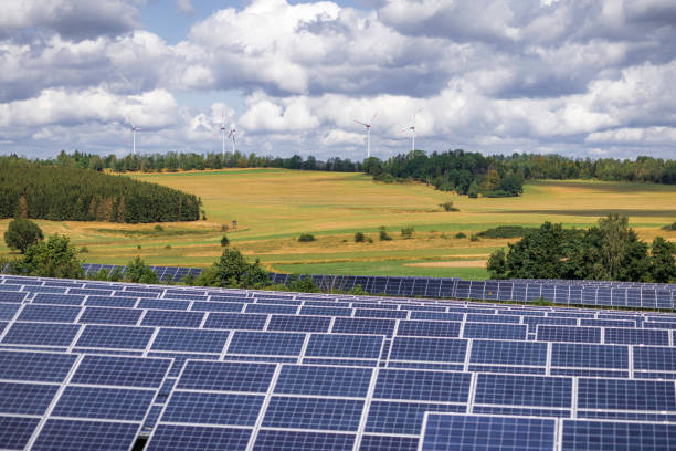istock modern solar panels and wind turbines in a rural landscape 2178243505