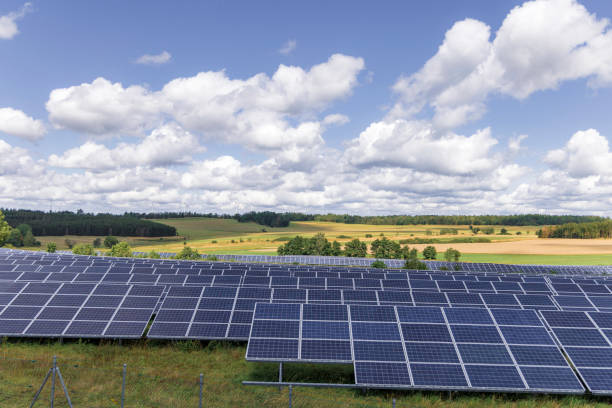 istock modern solar panels and wind turbines in a rural landscape 2178243527