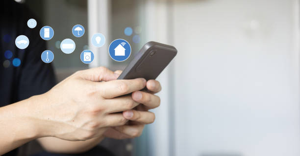 istock close up man hand holdings smartphone and open application technology for using home automation function with wifi 7  to looking inside or outside home and property for  ai innovation future concept 2178244132