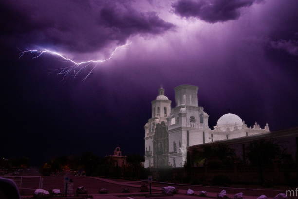Lightning bolt over San Xavier del Bac Mission in Tucson, Arizona, USA