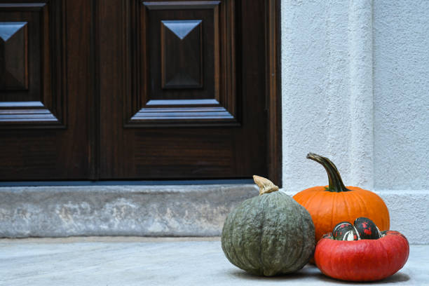 Pumpkins at the porch. Autumn, holiday season decorations.