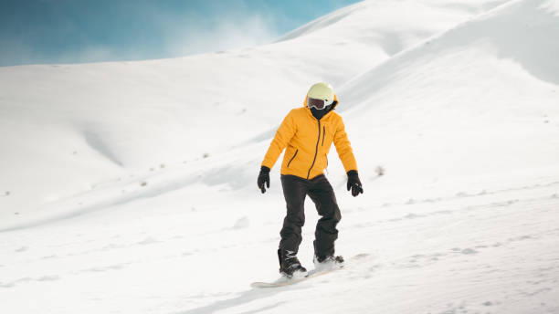 istock Man riding snowboard on snowy hill 2178246005