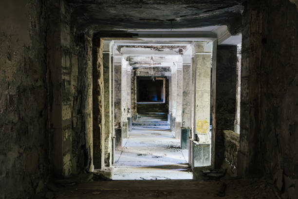 istock Dark hallway in abandoned crumbling building 2178252073