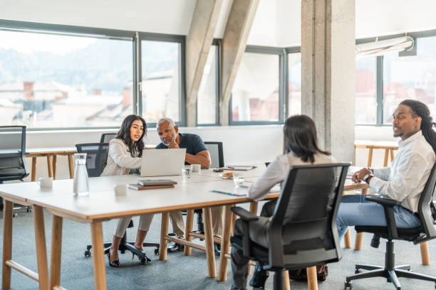 istock Diverse Executives Engage in Strategic Discussion in Contemporary Office 2178255550