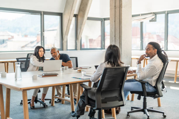 istock Diverse Team Engages in Discussion at Modern Office 2178255556