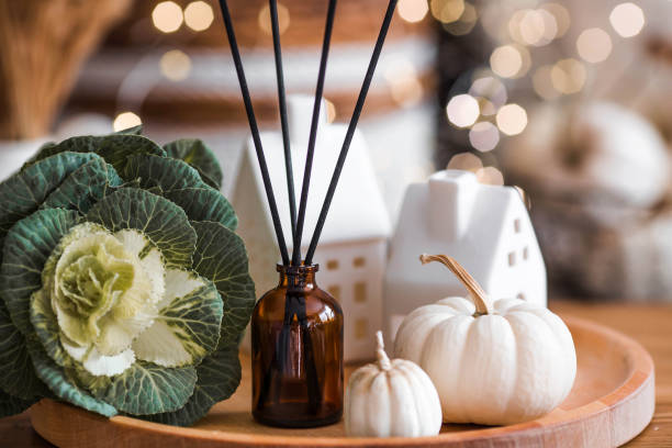 istock Aroma diffuser. Autumn scented perfumes for the home in a glass bottle with sticks as an air freshener in the house and pumpkins. Aromatherapy, cozy atmosphere, comfort and relaxation. 2178256201
