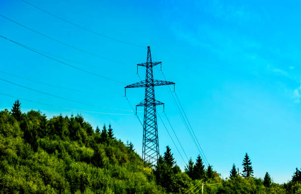 istock electricity transmission pylon silhouetted against blue sky 2178256227