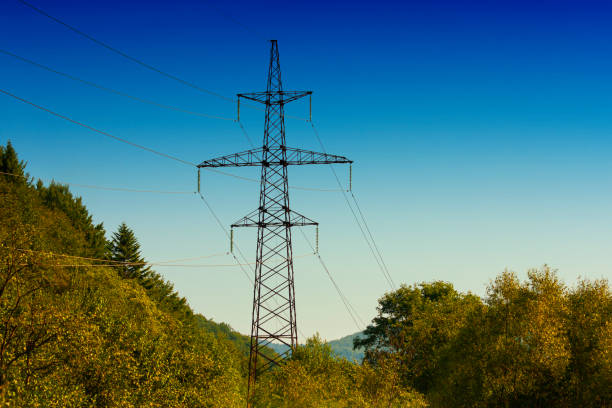 Electricity pylons in the nature / housing estate
