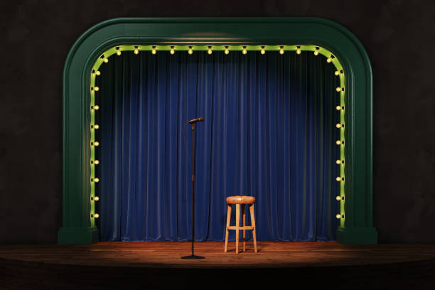istock A stand-up stage with a microphone, bar stool and spotlights. Empty theater stage. 2178256974