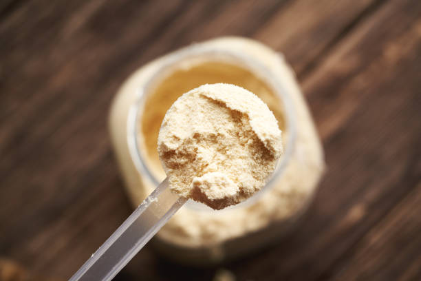 istock Whey protein powder in a measuring spoon above a jar 2178257962