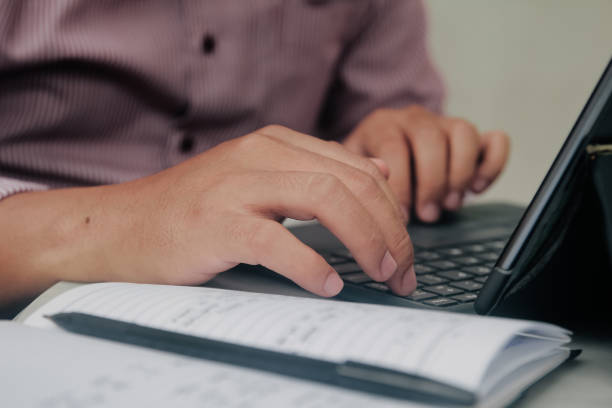 istock Close up of bussines man hands typing 2178258034