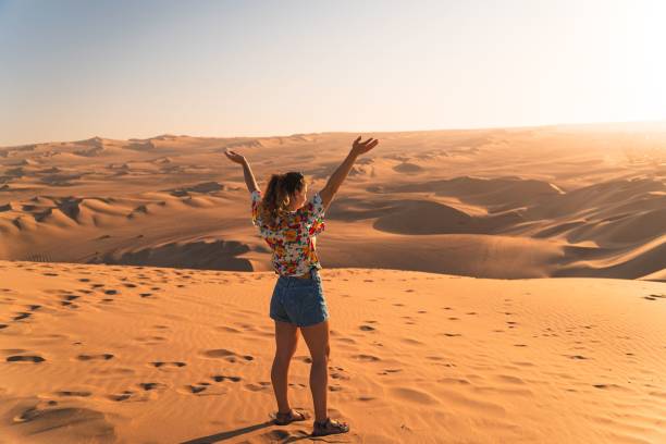 istock Woman Embracing Desert Landscape 2178260586