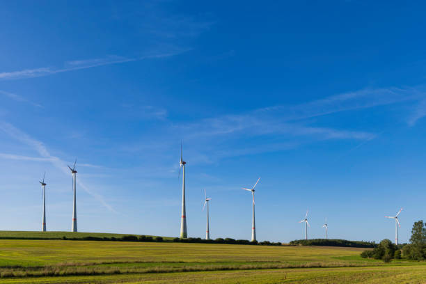 istock power generating wind turbines in the countryside 2178263613