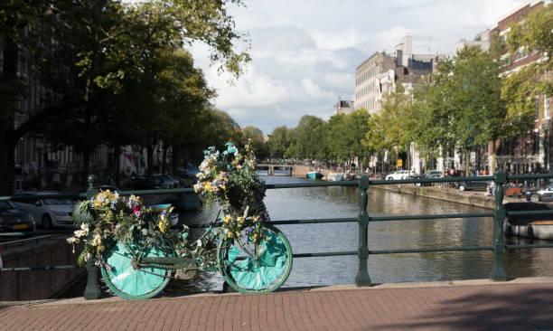 istock Bicycle covered by decorative garlands on a bridge in Grachtengordel 2178264137