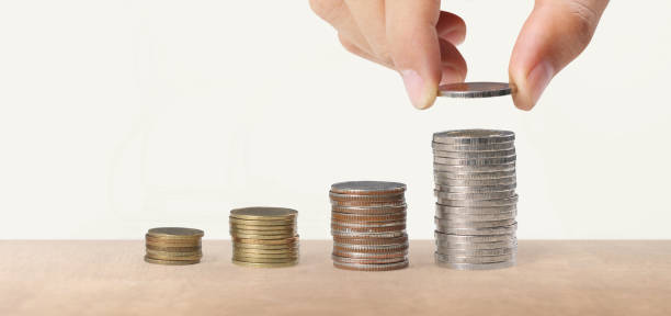 istock Hand laying coins on stacks coins in  row ,Business idea 2178271142