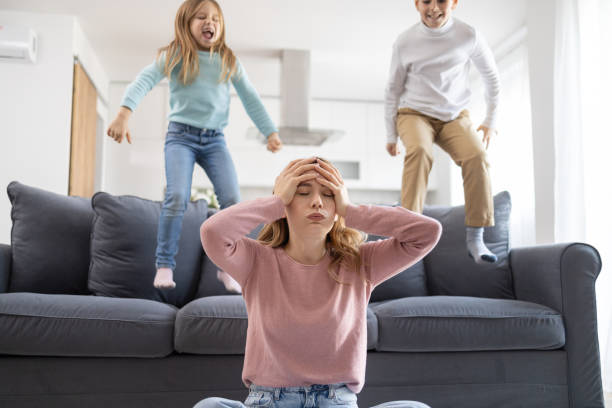 istock Pensive mother and active children 2178273443