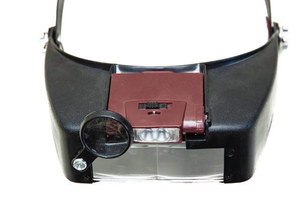 Glasses-magnifier with led illumination with a head mount. Isolated on a white background