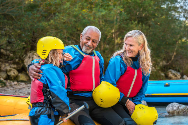 istock Diverse Family Adventure with Rafting Gear by the River 2178275111