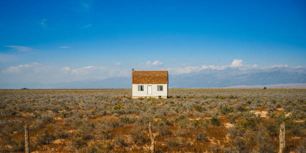 Southwestern Desert Wilderness Landscape with a weathered barn on the meadow in Colorado, USA