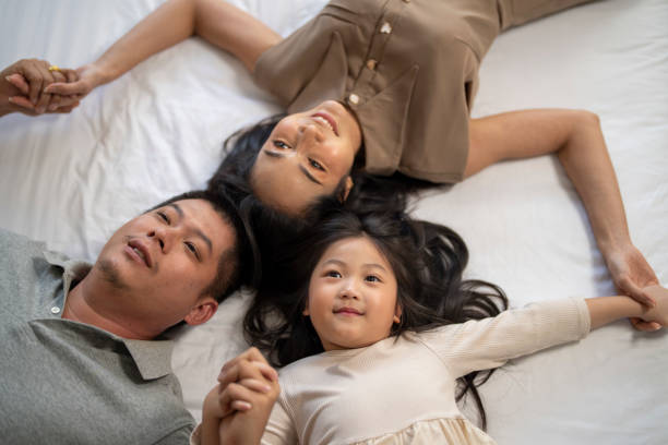 istock Family playing in bed 2178282075