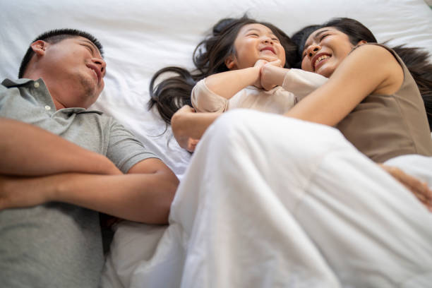 istock Family playing in bed 2178282190
