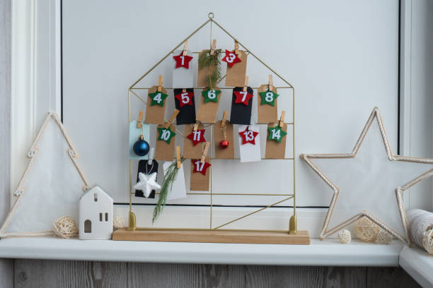 istock Number on craft paper notes with tasks before Christmas holidays. Female making kraft paper for handmade advent calendar Made with your own hands step by step DIY 2178284113