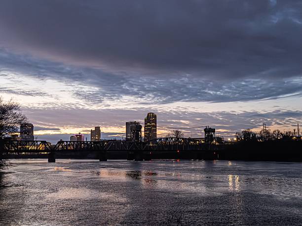 The Little Rock Arkansas skyline reflected in the Arkansas River at sunrise on a winter's day