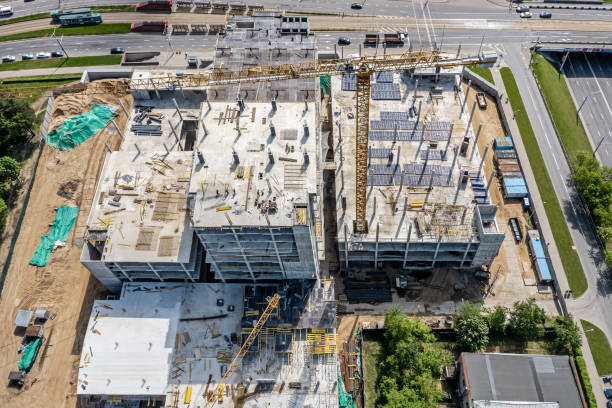 istock new shopping mall under construction. concrete construction site with crane. aerial photo. 2178286458