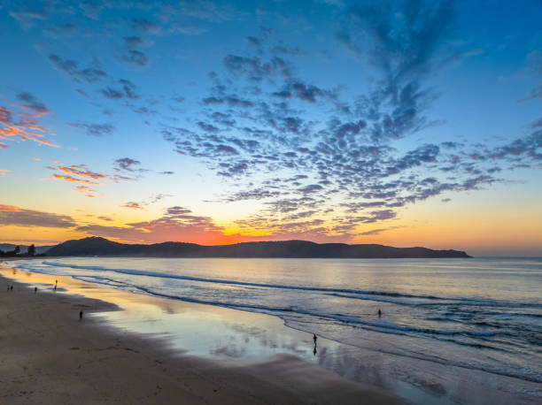 istock Sunrise seascape with pretty clouds in the sky 2178286788