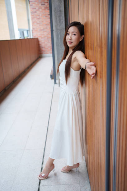 istock middle-aged woman leaning against wall 2178288272