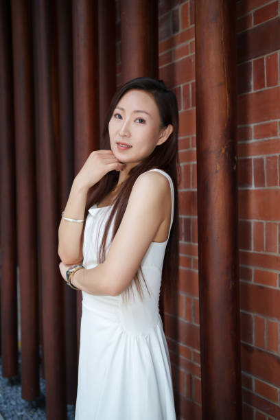 Beautiful woman wearing white dress