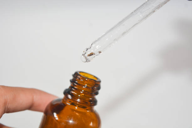 istock Cosmetic pipette with a drop close up on white background 2178289261