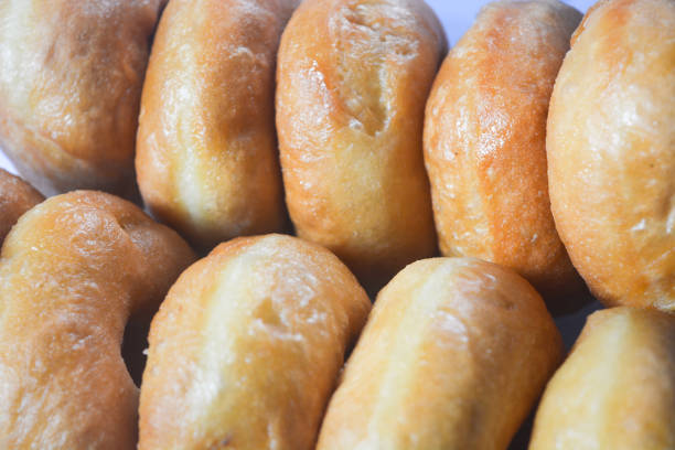 Close up of original donuts without toppings on a white background. Isolated objects