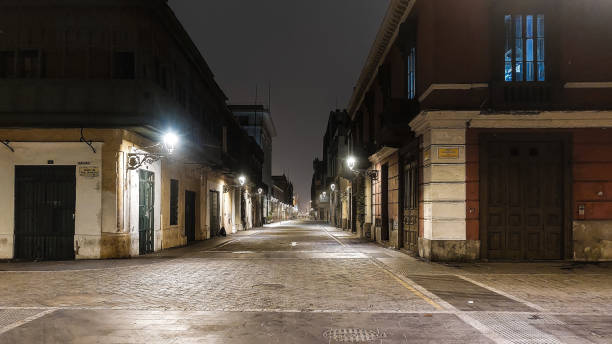 istock Cobbled viceregal style street at night with warm lantern lighting 2178291105